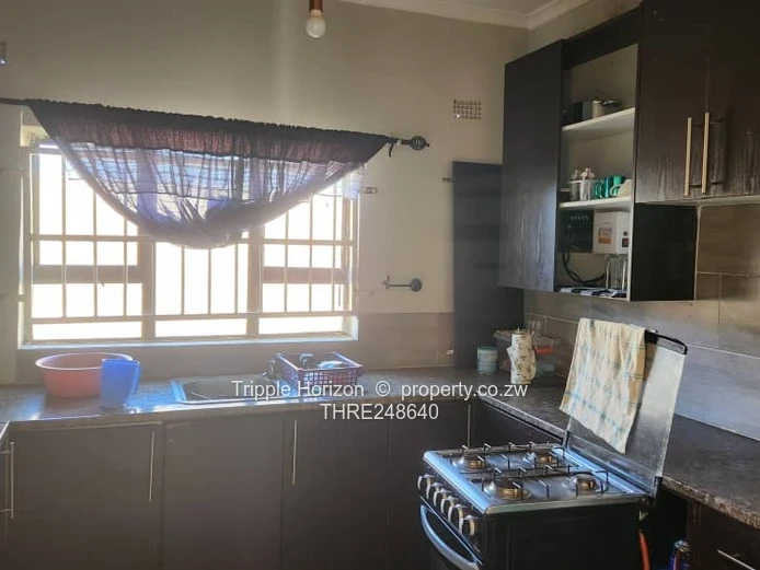 Walled Ruwa 2BR Home with Solar, Flatlet & Tank