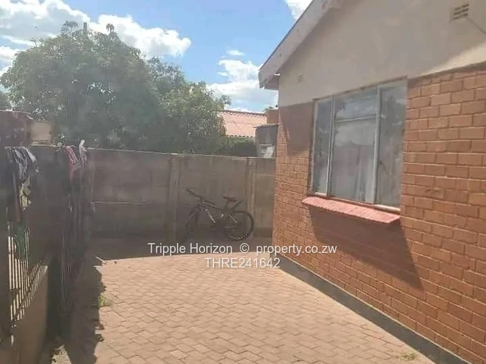 Chitungwiza 4-Bed Brick Home with Secure Paved Yard